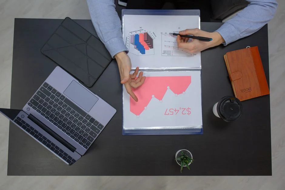Bright highlighters placed beside a User-Generated Content note on a wooden desk.